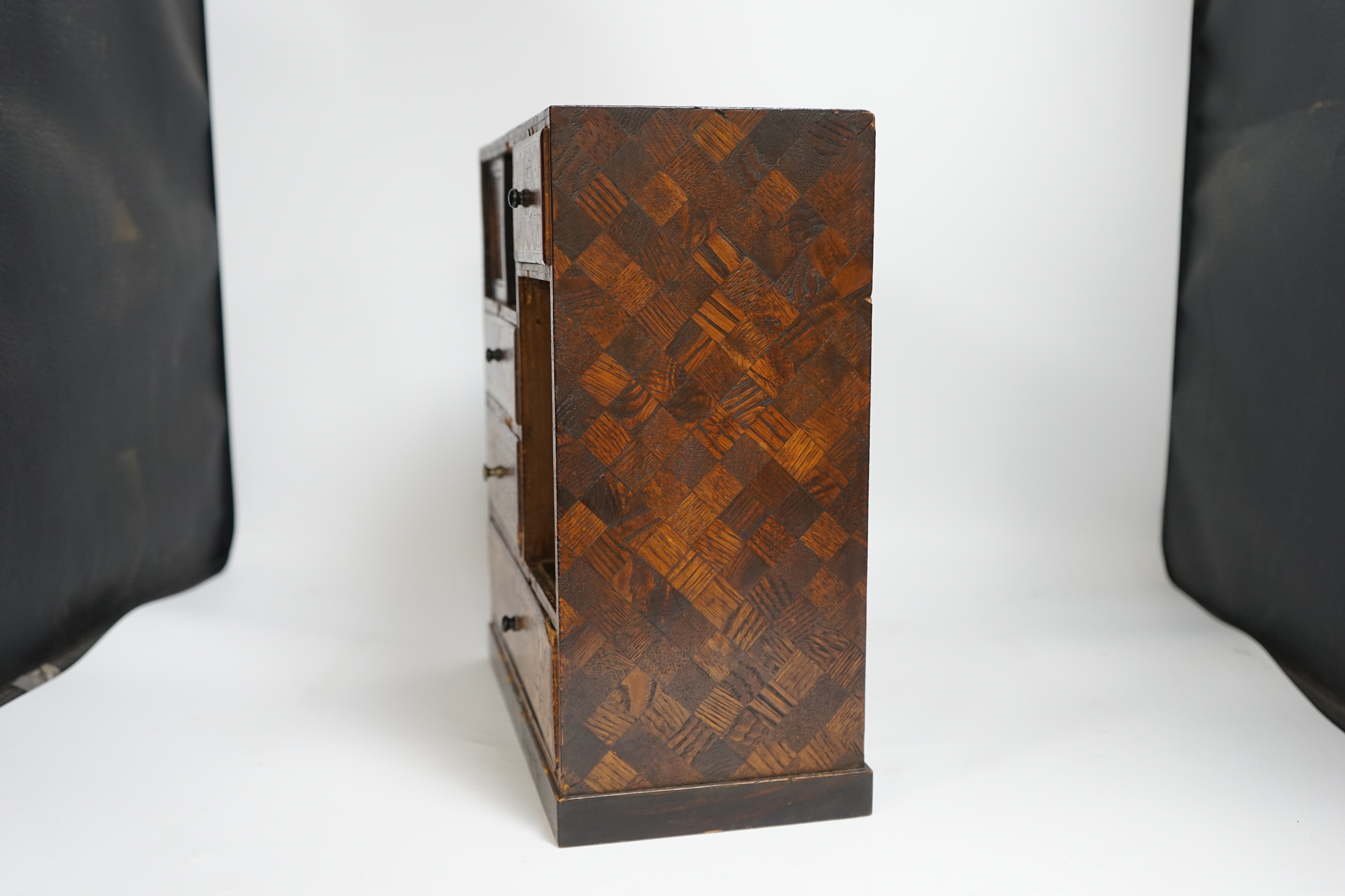 A late 19th century Japanese Hakone ware marquetry inlaid miniature cabinet, 34cm tall